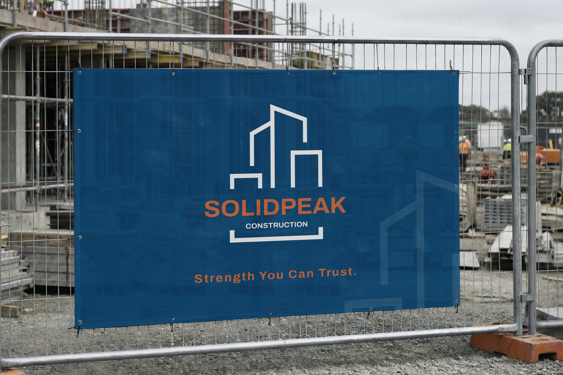 Solidpeak Construction blue mesh banner on the construction site with branded elements