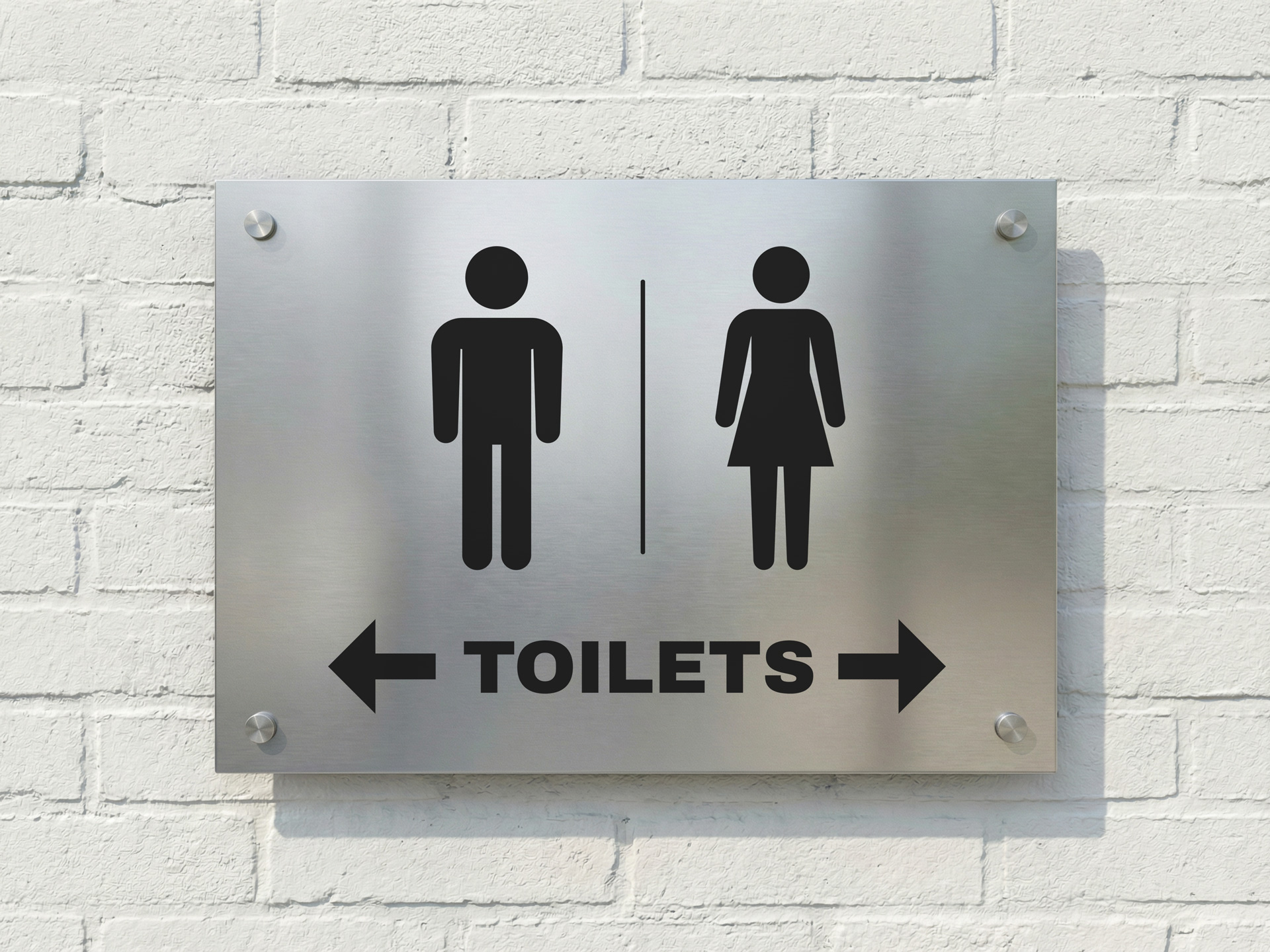 brushed metal restroom sign with male and female icons