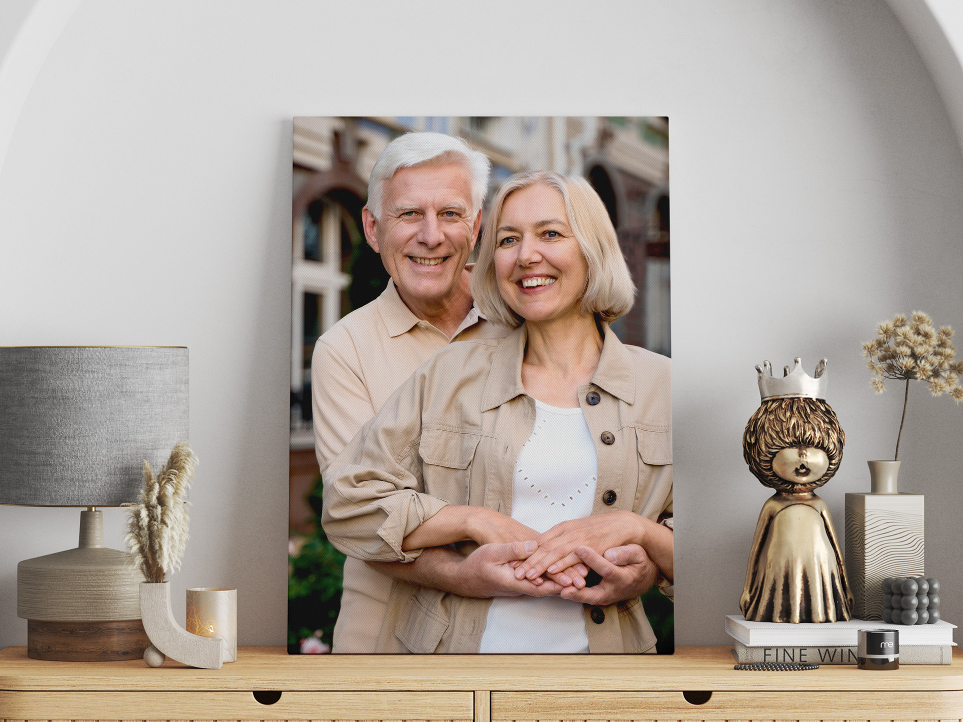 A portrait of a smiling married couple leaning against the wall