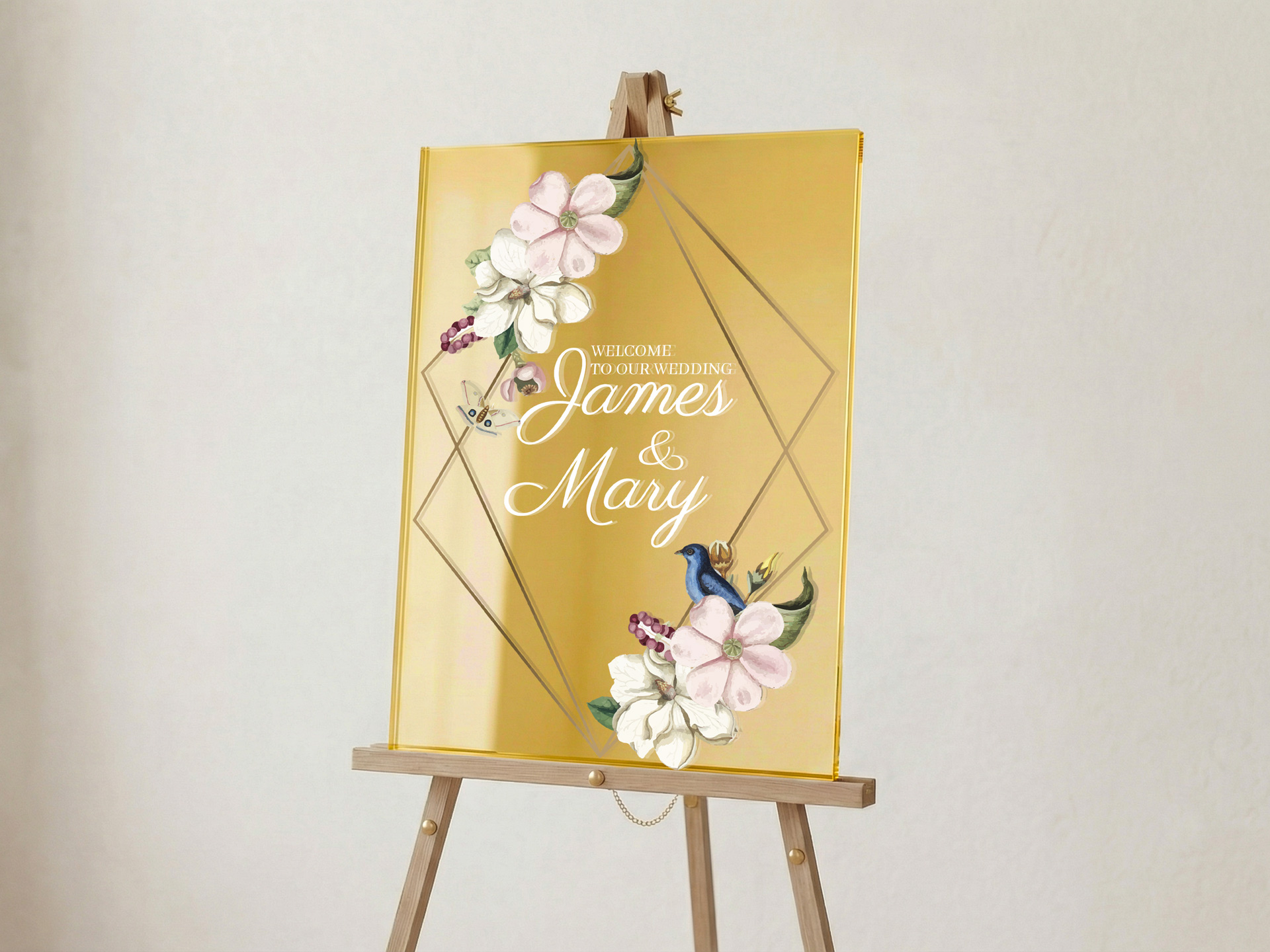 Gold welcome sign with florals