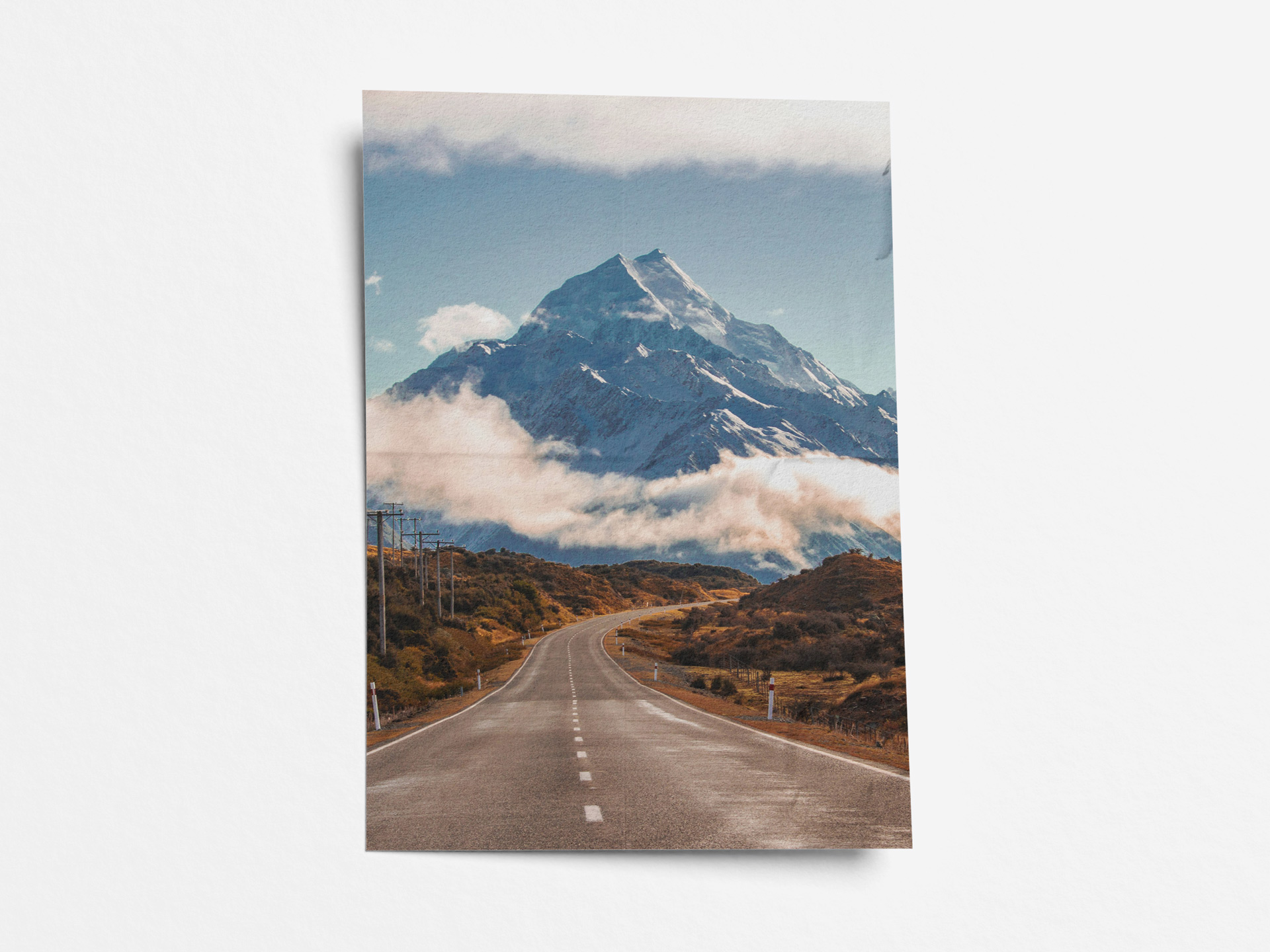 A paper poster printing displaying a mountainous landscape