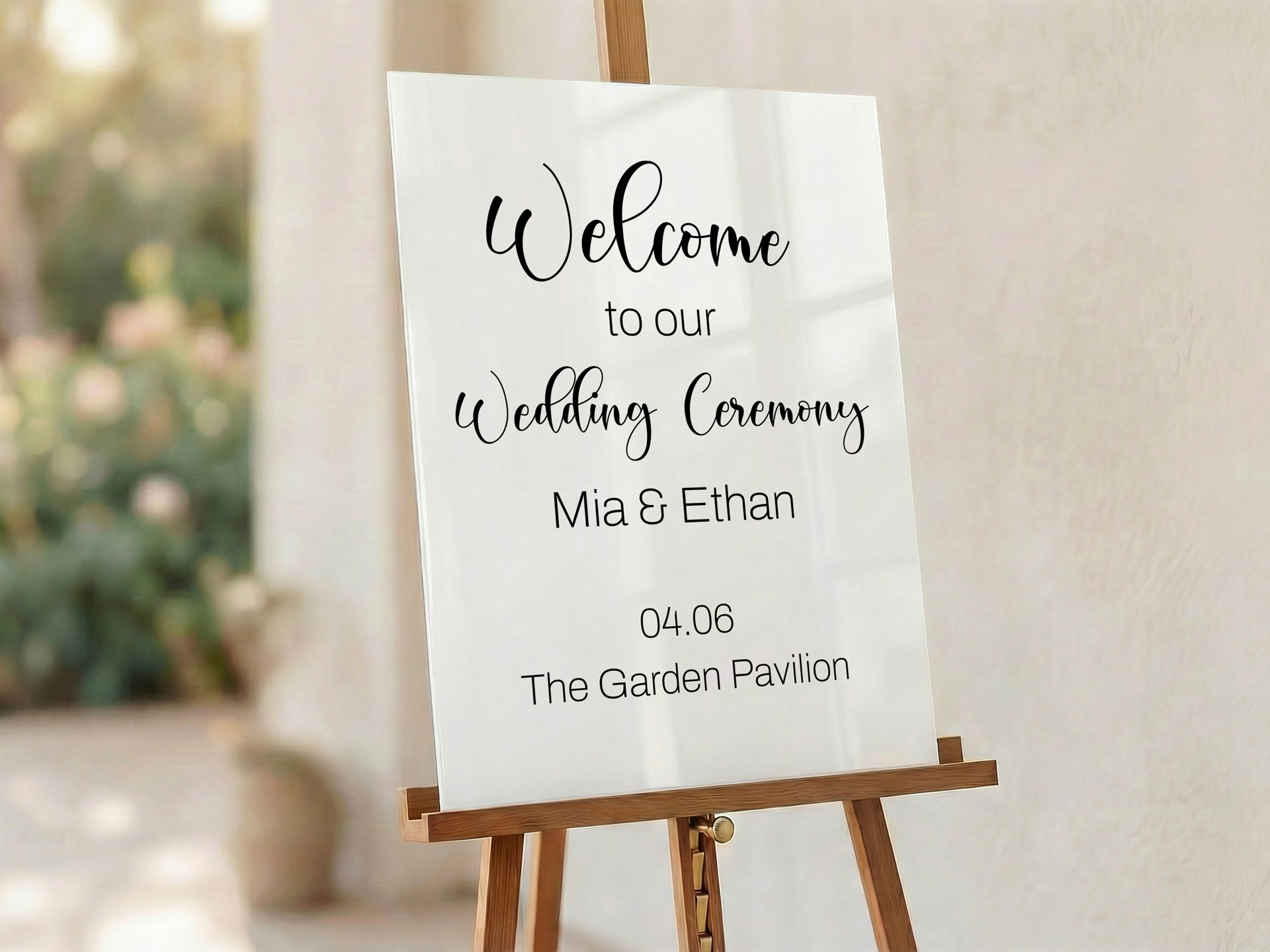 Elegant white wedding welcome sign on easel