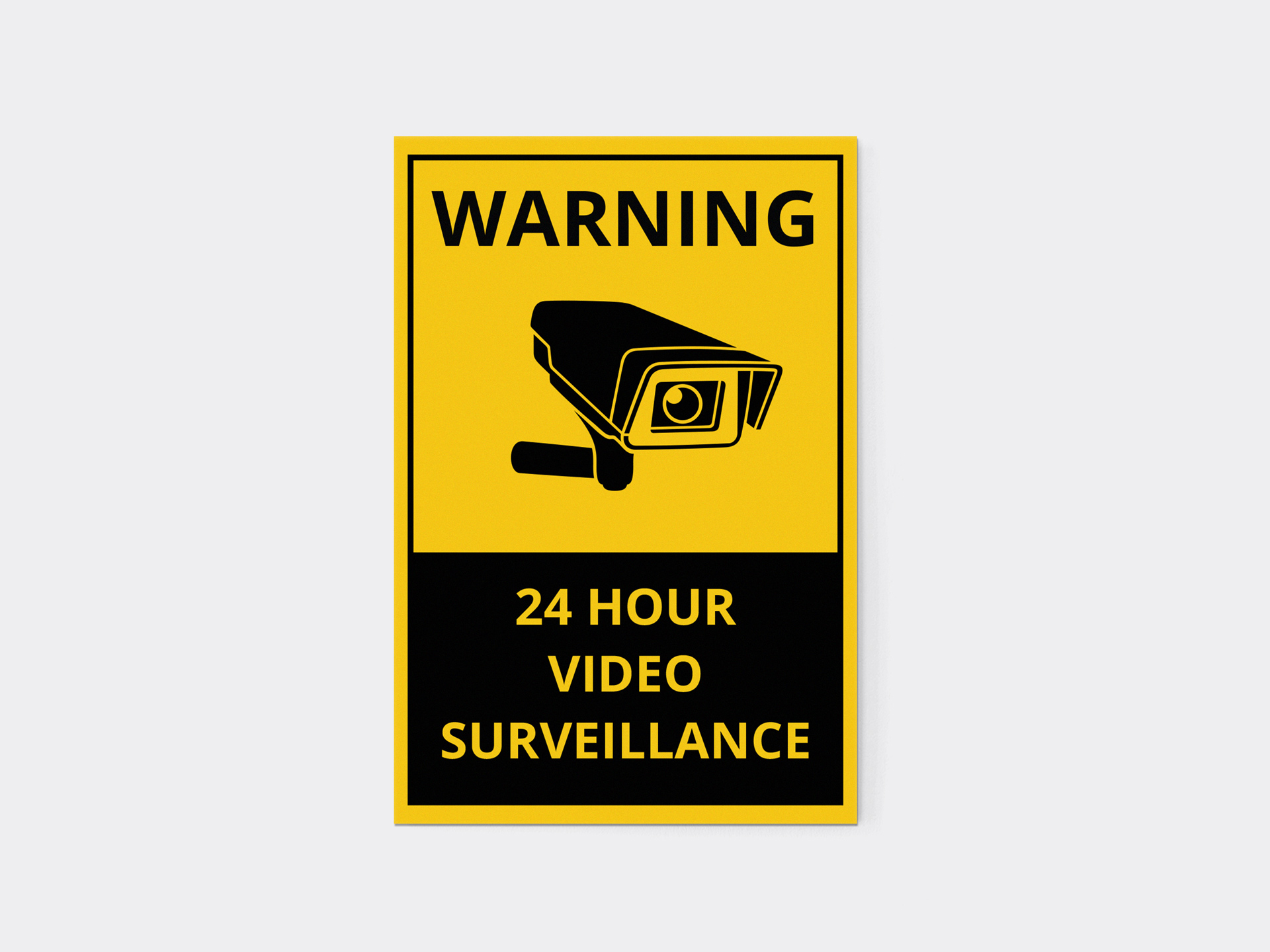 24-hour video surveillance warning sign with camera symbol.