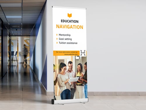Educational retractable banner promoting mentorship, goal setting, and tuition assistance programs.