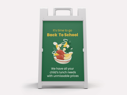 Green back to school sign featuring a lunch box and food items.