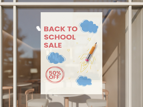 Bright back to school sign featuring sale text with clouds and 50% off discount.