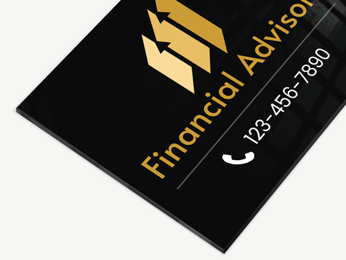 Black acrylic sign showcasing the text Financial Advisors, the logo and the phone number