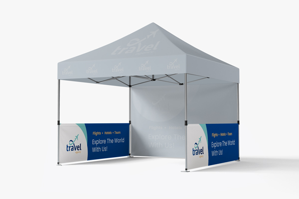 Tent half walls showcasing a company name and logo on the sides of a canopy tent.