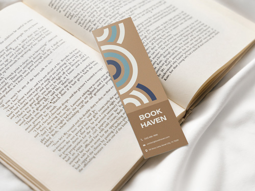 A stylish "Book Haven" bookmark with a modern design placed inside an open book.