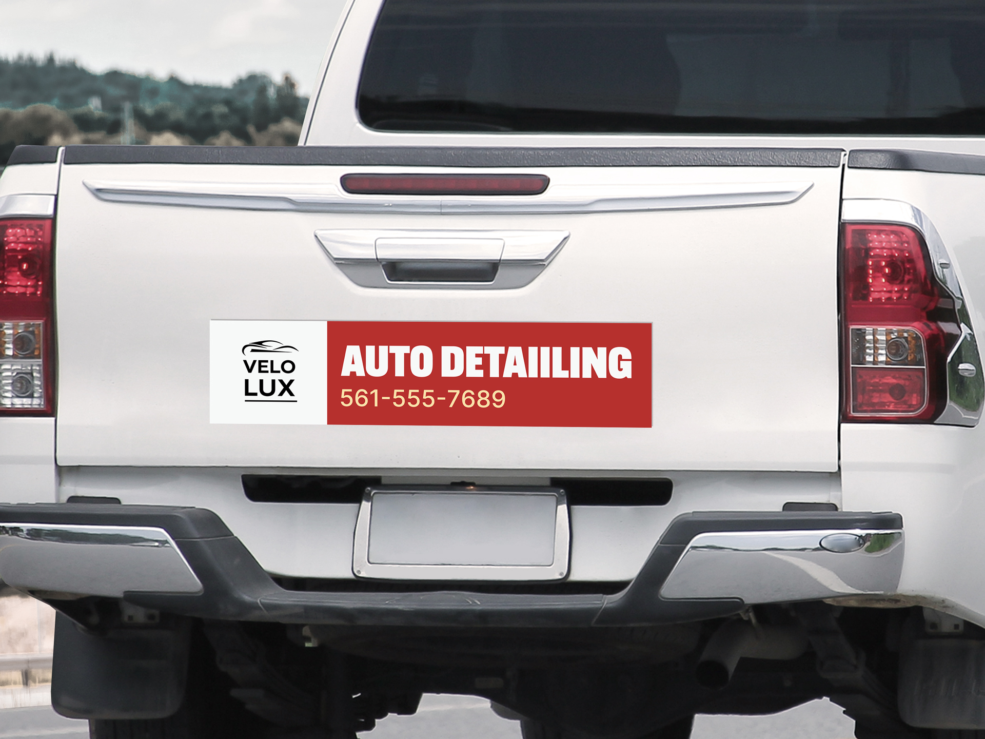 Velo Lux bumper car decal featuring contact info.