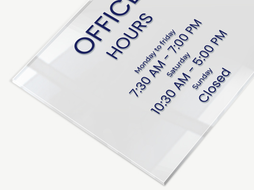 Clear acrylic sign for an office featuring business hours