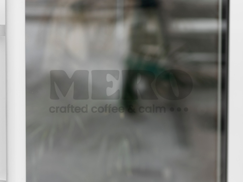 Clear vinyl lettering on the window for a coffee shop.
