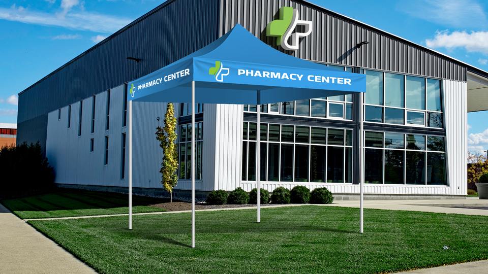 Pharmacy Center commercial canopy tent with a logo installed in front of a pharmacy.