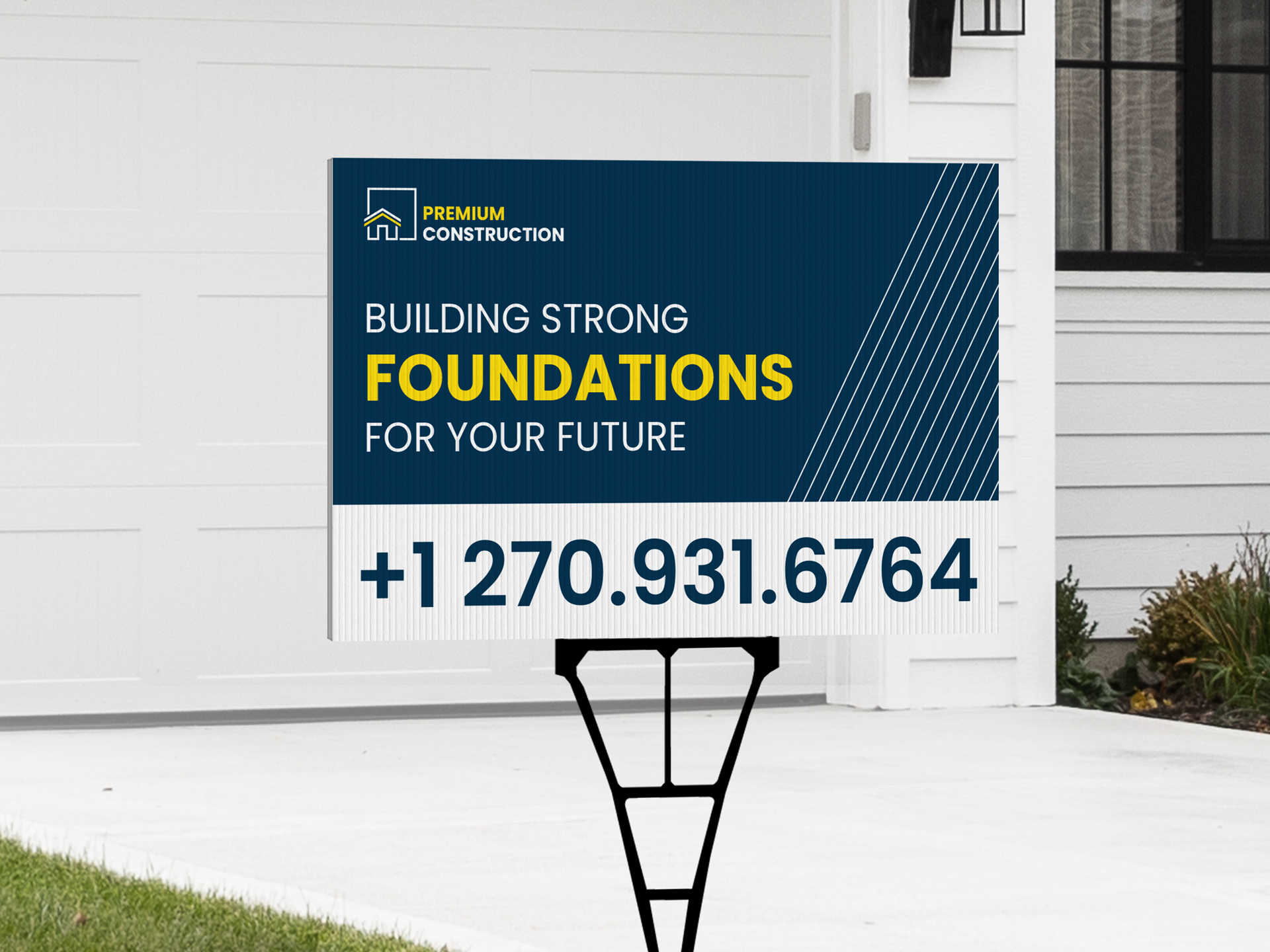 A construction company yard sign in front of a house used for branding purposes.