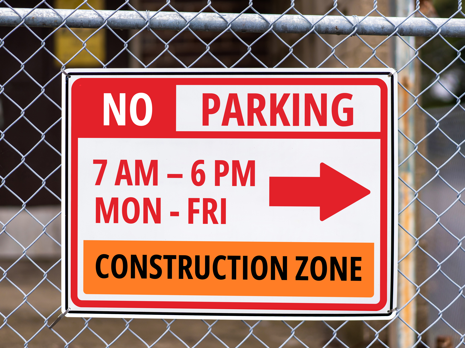 A no-parking sign is installed in the construction zone and shows the time when parking is prohibited