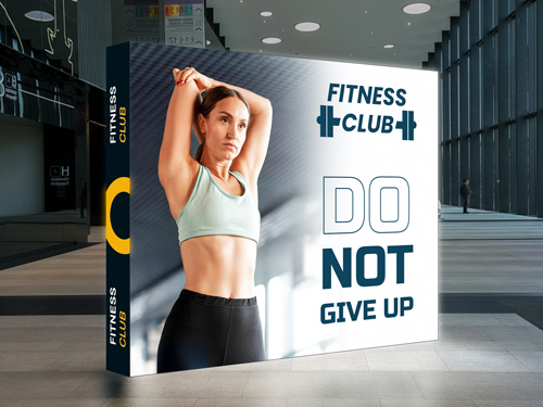 A striking SEG backlit popup display for a Fitness Club with an inspirational message.