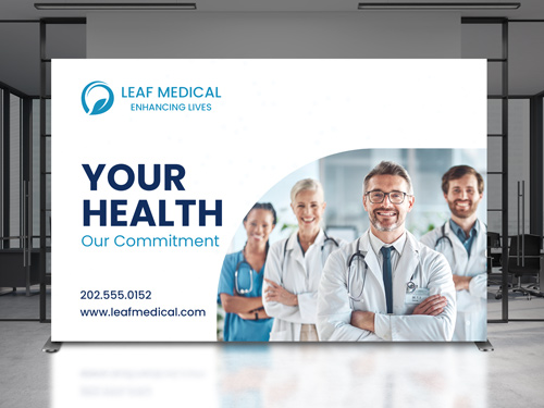 Corporate office backlit SEG fabric display reading Your Health Our Commitment.