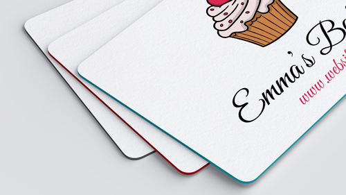 Charming painted edge business cards showcasing a cupcake image and brand name