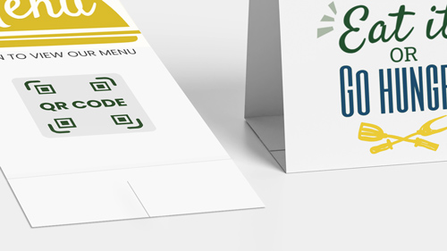 Double-sided restaurant table tent with QR code menu and Eat in or Go Hungry message.