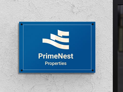 A blue Dibond logo sign for PrimeNest Properties for branding.