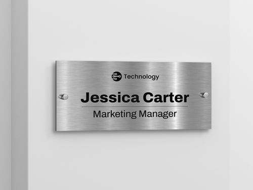 A Dibond name plate on the wall for a marketing manager.