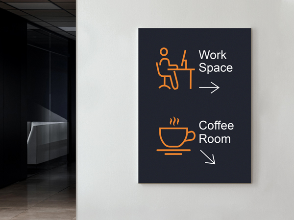 Wall-mounted wooden directional sign showing work space and coffee room arrows in a modern office hallway.