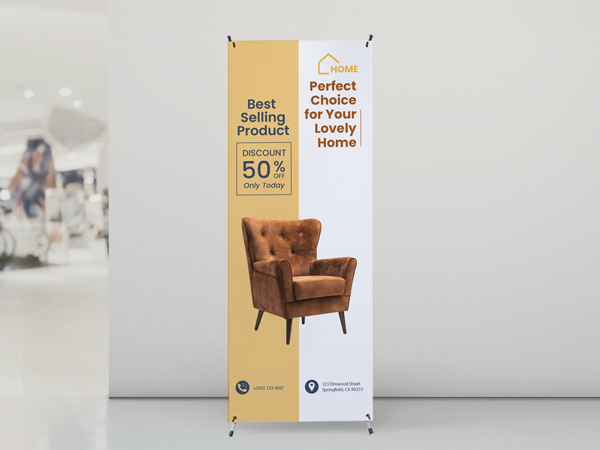 A retail furniture store x-stand banner showing a fifty percent discount offer on items in the store.