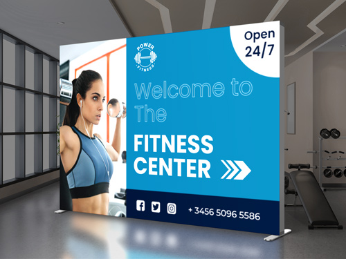 Fitness Center backlit SEG fabric display featuring a woman image in the gym.