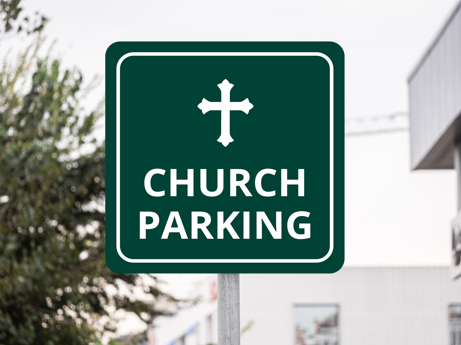 Bold church parking lot signage featuring a cross symbol.