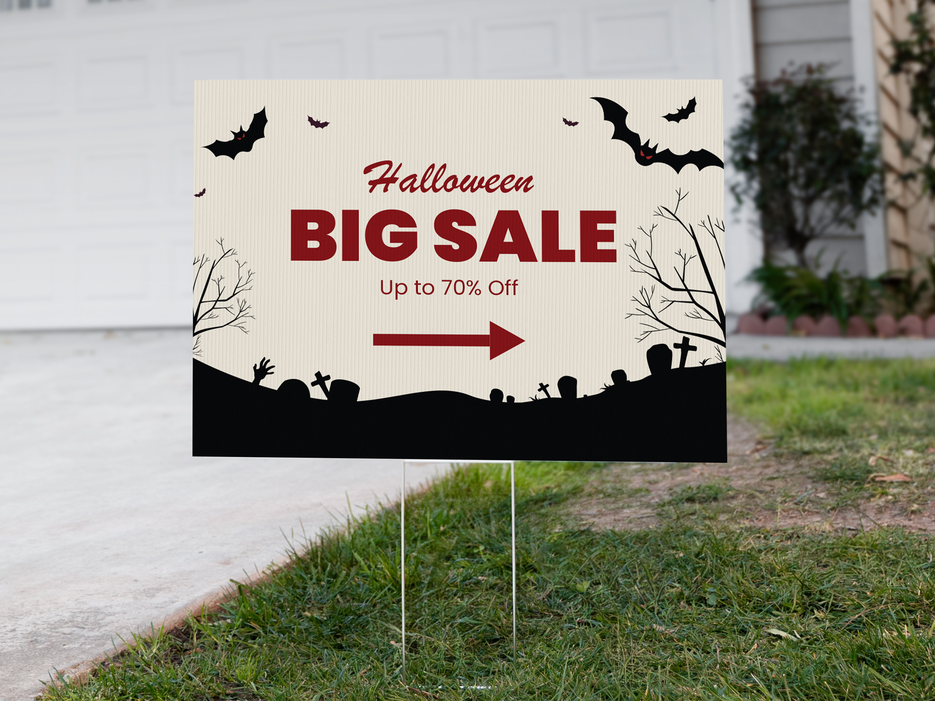 Halloween yard sign advertising big sale with directional arrow.