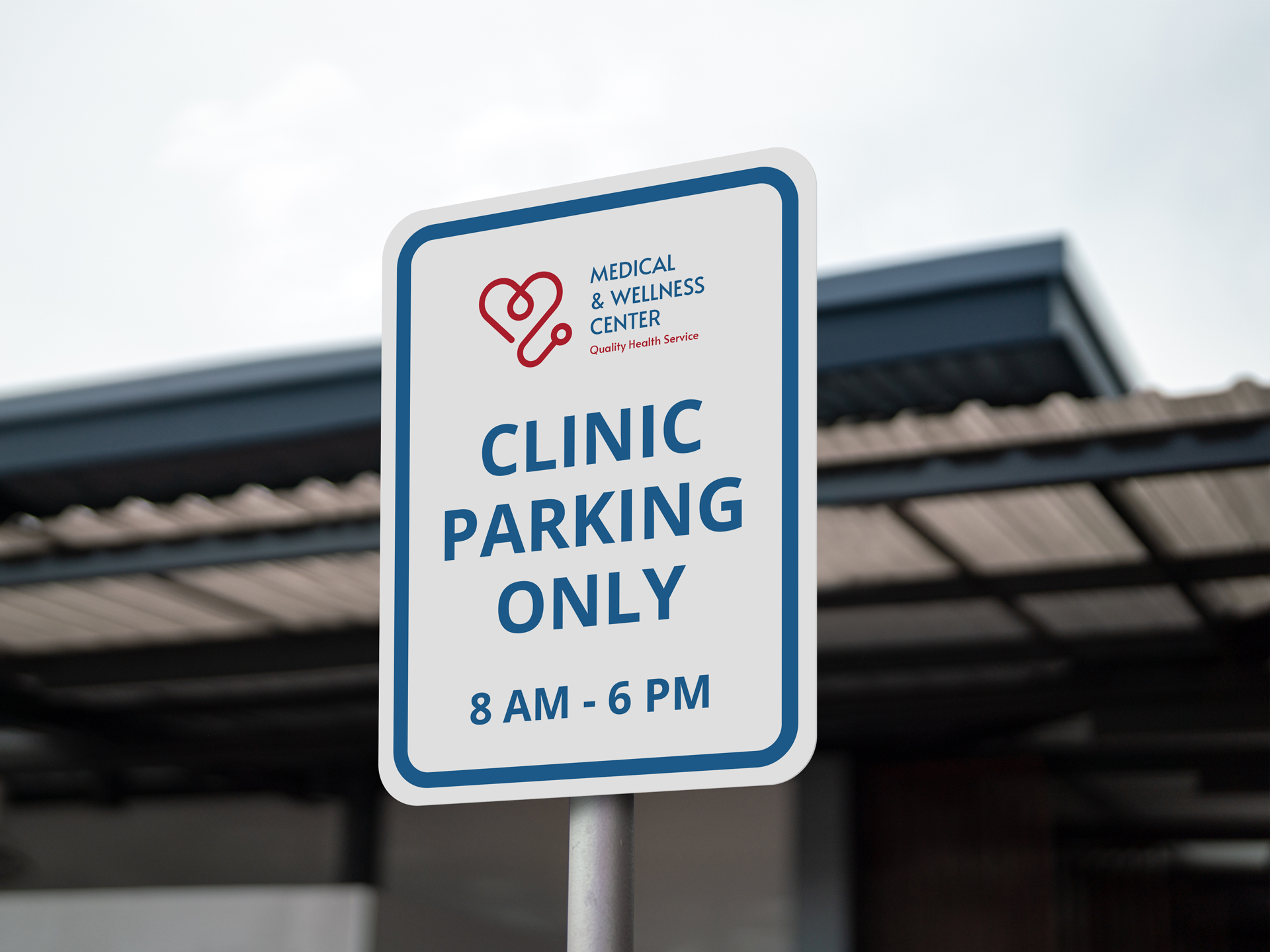 A healthcare parking sign template is installed near the hospital and reads "Clinic Parking Only" in blue against a white background