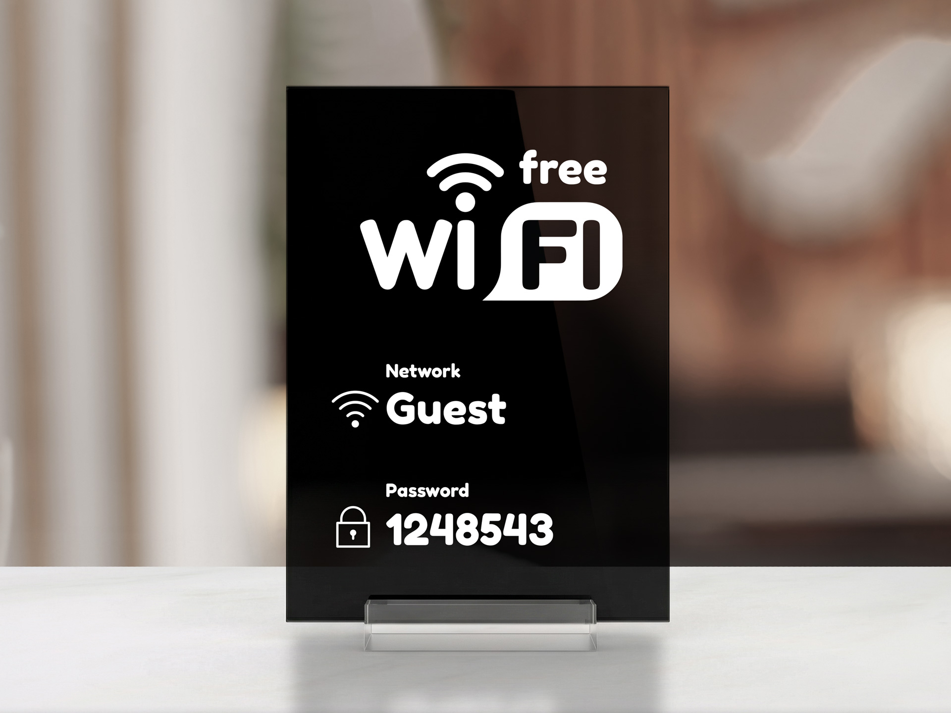 Black and white acrylic tabletop sign announcing about availability of free WiFi.