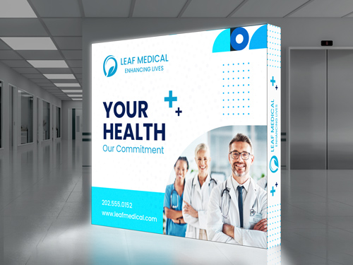 An inviting SEG backlit popup display with the hospital staff reading Your Health.