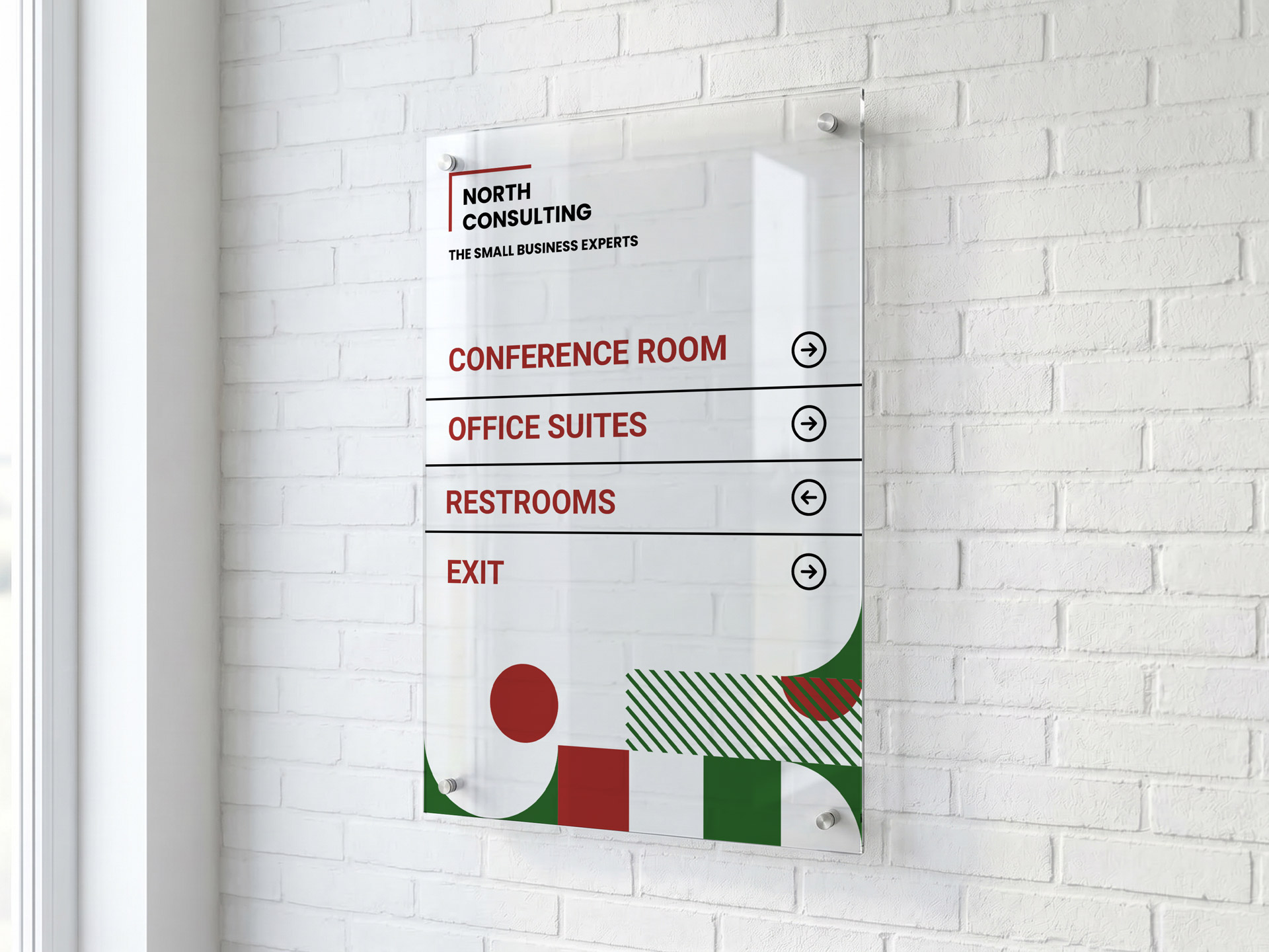An acrylic wayfinding sign mounted on a brick wall, guiding visitors to different directions.