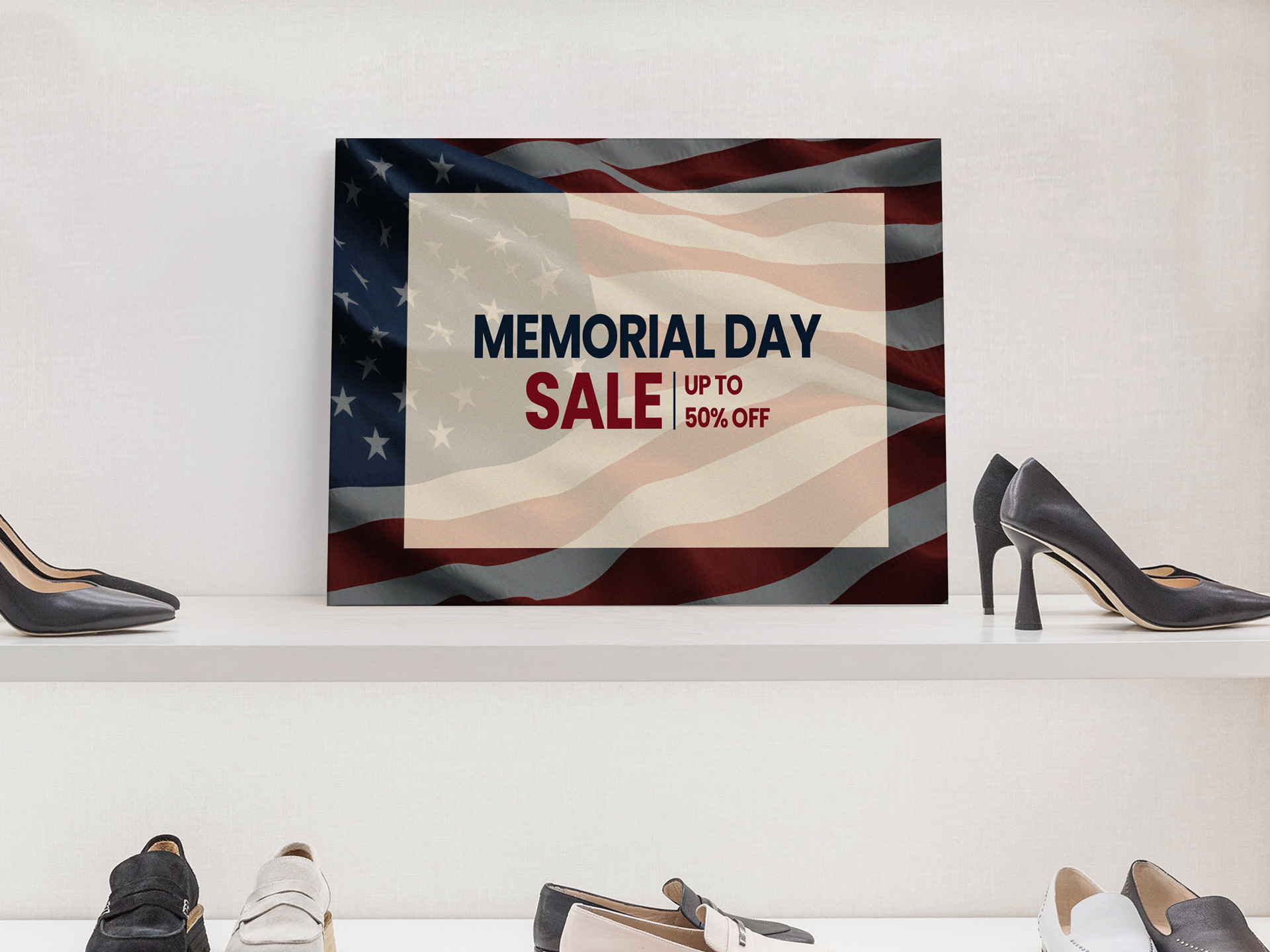 Memorial Day retail foam board sign promoting sale.