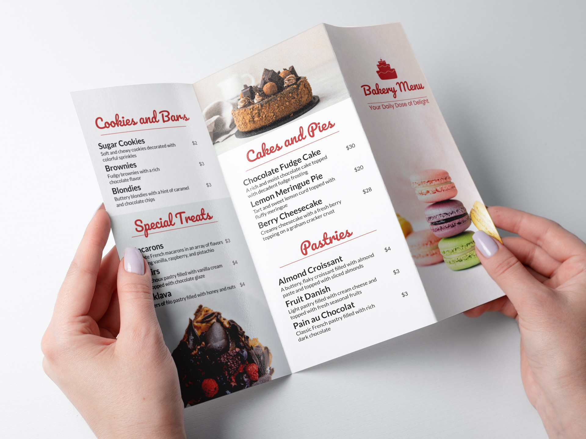 A trifold bakery menu brochure held open in two hands.