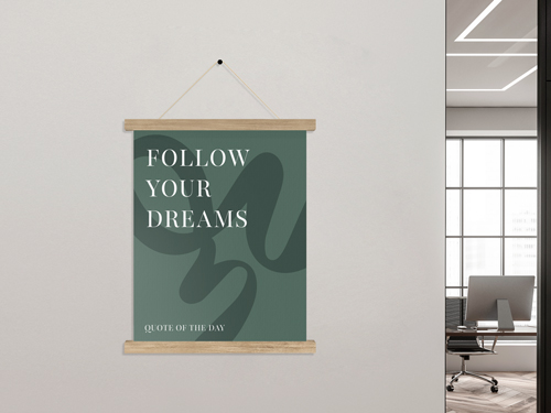 Inspirational quote poster in magnetic wood hanger on office wall