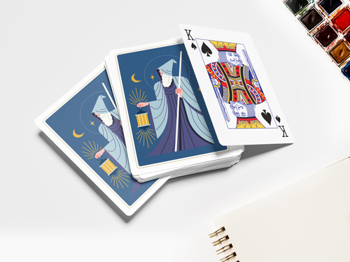 Artistic playing cards featuring a mystical wizard design on the back, with a fully revealed King of Spades