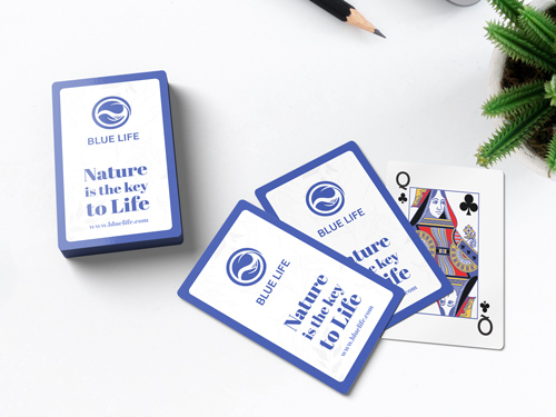 Elegant playing cards with 'Blue Life' branding and the Queen of Clubs partially revealed