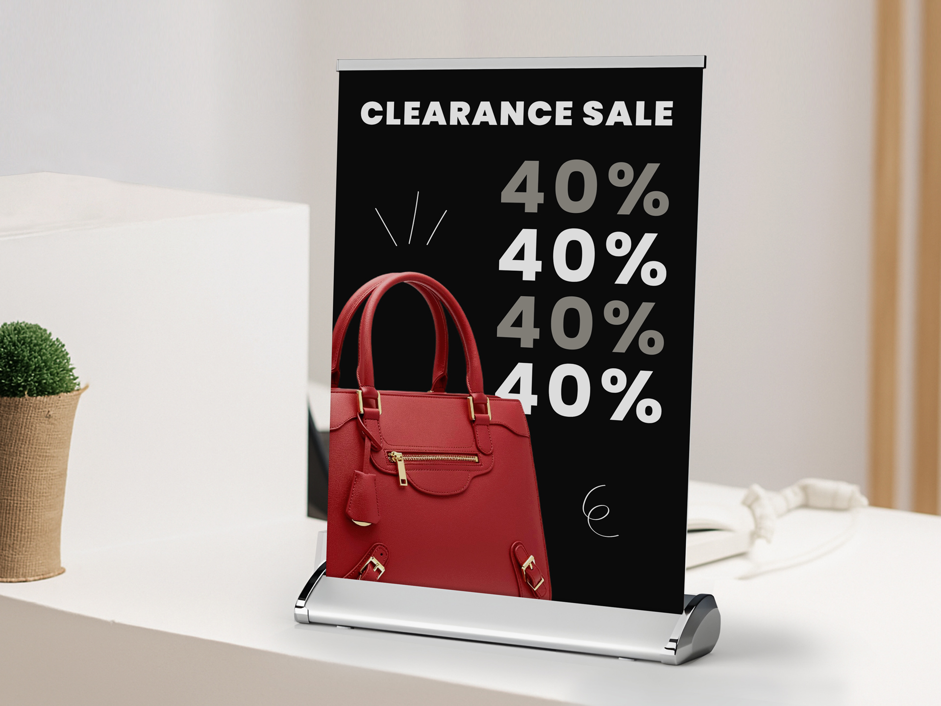 Clearance sale tabletop retractable banner announcing 40% sale.