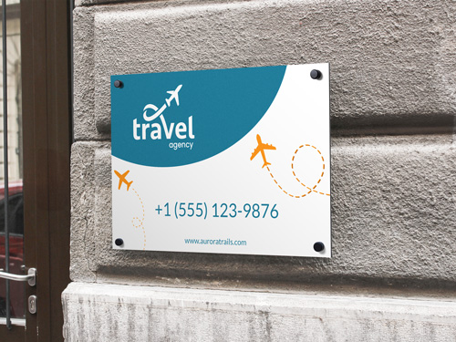 A promotional Dibond sign for atravel agency with contact details.