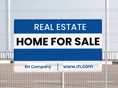 Real Estate mesh banner attached to a fence for Home For Sale.