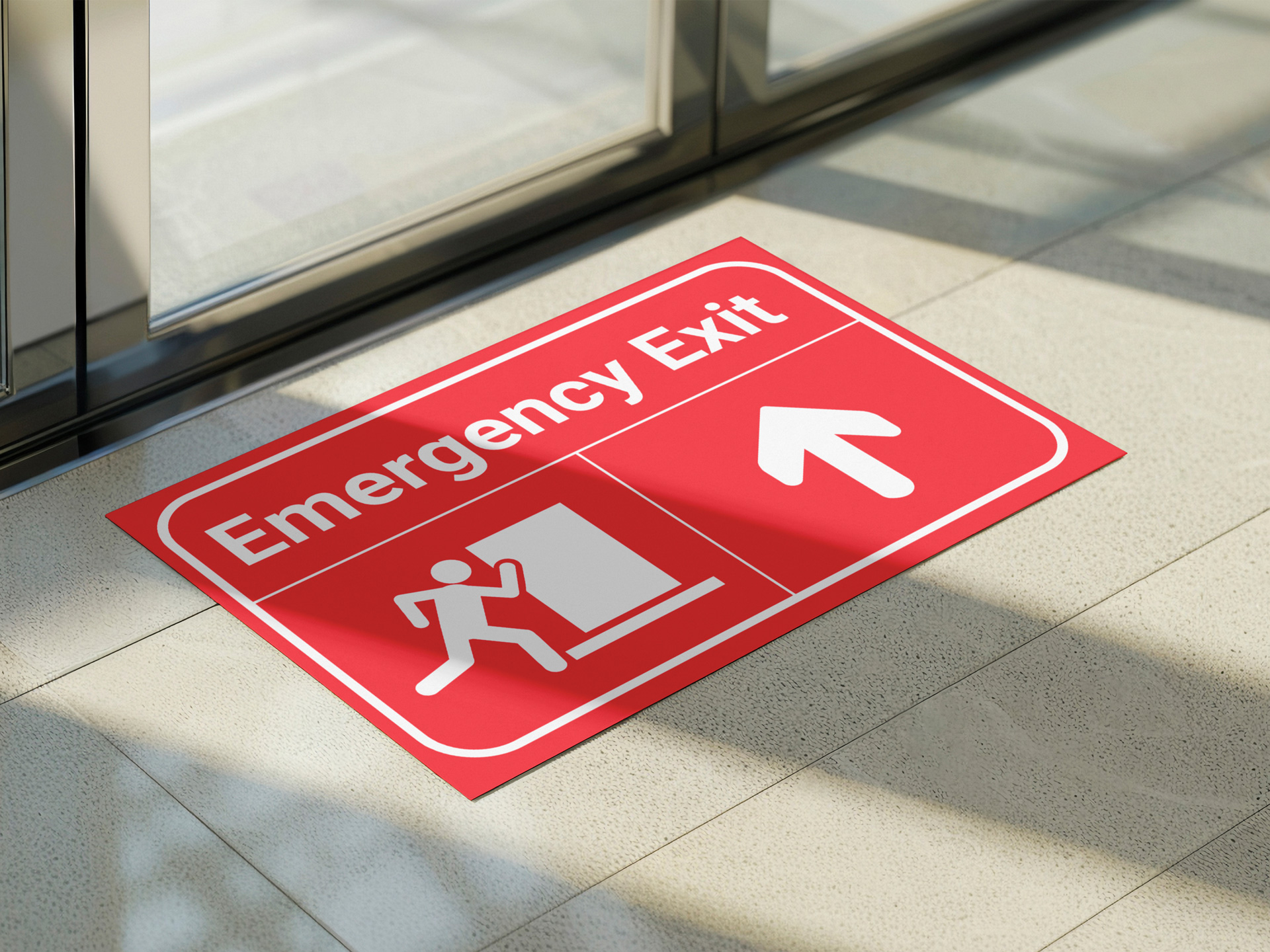 Emergency Exit red floor decal with a white directional arrow