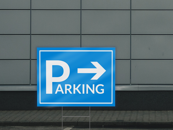 Blue reflective coroplast sign for event parking with a directional arrow.