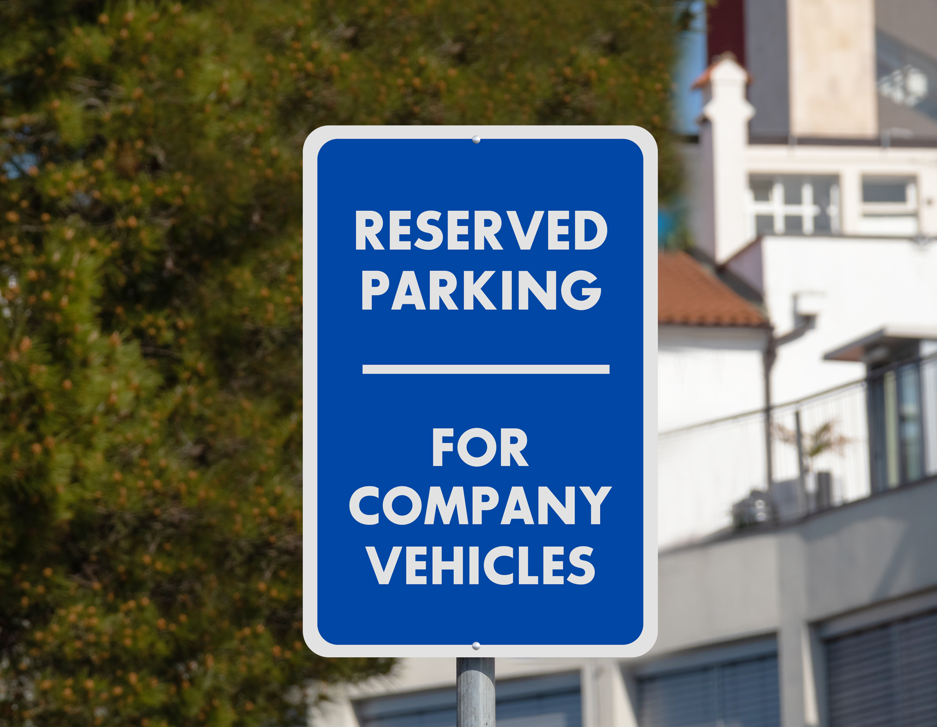 A red and white reserved parking sign reads "No Trespassing," "Private Drive"