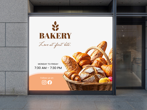 Bakery storefront backlit decal featuring basket of fresh bread and pastries with store hours.