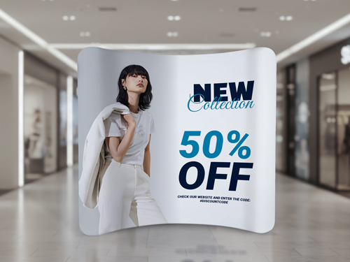 A curved tension fabric display for retail promotions featuring a stylish women with promotional text.