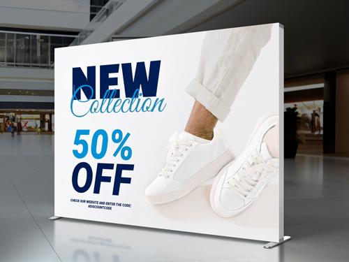 Retail spaces backlit SEG fabric display reading New Collection 50% Off.