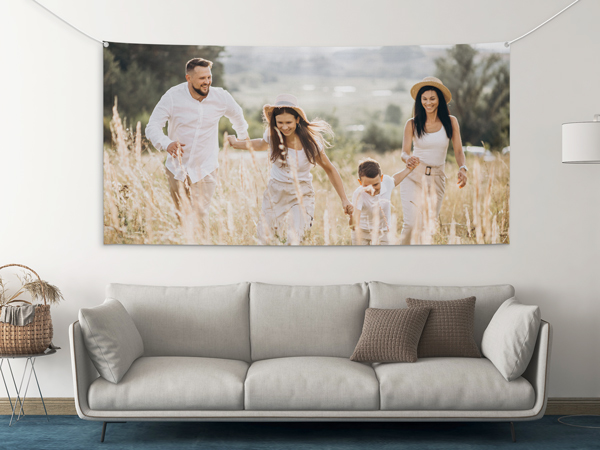 Large family portrait rolled canvas print on white wall in modern room.