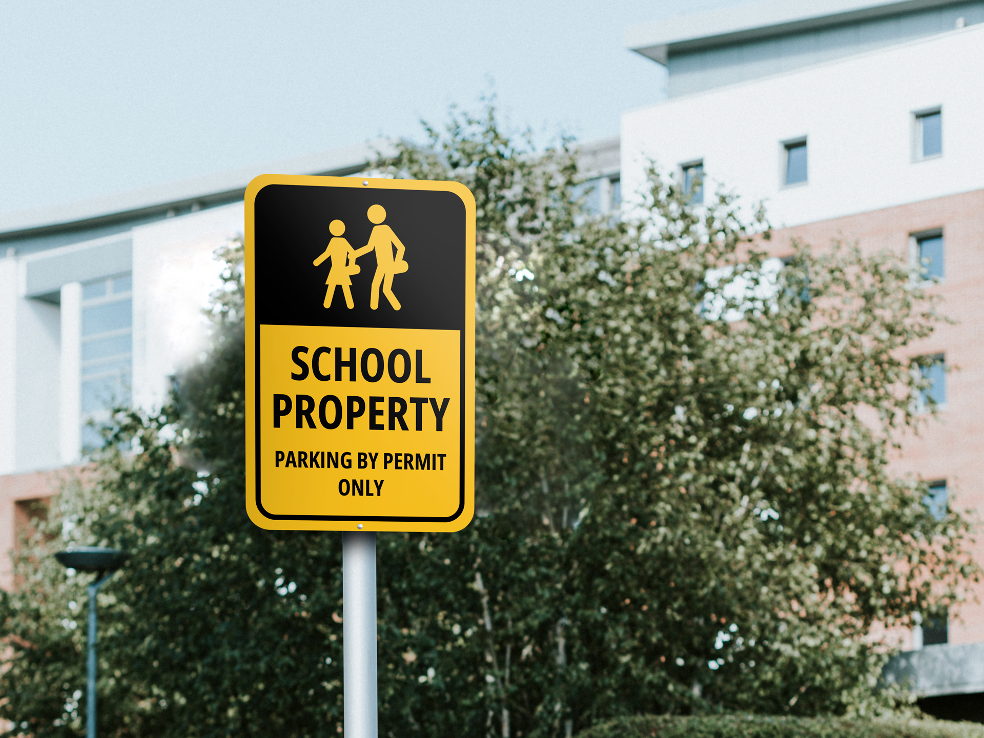 A black and yellow school parking sign illustrates two pedestrians and reads "School Property," "Parking by Permit Only"